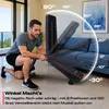 A man is adjusting a black and red adjustable weight bench in a living room setting. The image includes a graphic overlay showing different angle settings. Produktbild-Vorschau