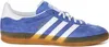 A side view of a blue Adidas Gazelle Indoor sneaker against a white background. Produktbild-Vorschau