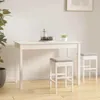 A white dining table with two white bar stools with gray seats in a room with a plant and a framed picture on the wall. Produktbild-Vorschau