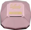 A close-up, top-down view of a pink, faceted perfume bottle cap with gold lettering. Podgląd zdjęcia produktu