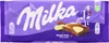 A Milka Happy Cow chocolate bar wrapper with a depiction of a cow and a piece of the chocolate bar. Náhled obrázku produktu