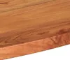 Close-up view of a wooden table edge, highlighting the natural wood grain and irregular live edge. Podgląd zdjęcia produktu