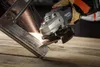 A person is using an angle grinder to cut metal, creating sparks. Náhľad obrázku produktu