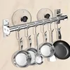 A kitchen utensil rack mounted on a wall, holding various cooking tools and pot lids. Produktbild-Vorschau