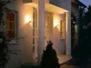 A house entrance at night, illuminated by outdoor lights. Anteprima dell’immagine prodotto