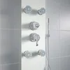 A modern shower panel system with multiple shower heads and controls, mounted on a white panel against a tiled wall. Podgląd zdjęcia produktu
