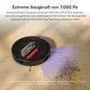 A robot vacuum cleaner is shown on a textured surface, with dust and debris being collected. A purple light beam emanates from the vacuum, indicating its cleaning path. Produktbild-Vorschau