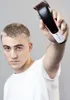 A man holding a hair clipper. Podgląd zdjęcia produktu