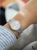 A person wearing a watch on their wrist. Produktbild-Vorschau