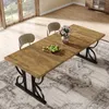 A dining table set in a dining room with two chairs, a vase of flowers, and a bowl of fruit on the table. Produktbild-Vorschau