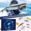 A fisherman holding a large fish, with fishing lures and a gift box in the foreground. Produktbild-Vorschau