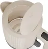 Close-up view of the open lid and interior of a cream-colored electric kettle. Podgląd zdjęcia produktu