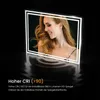 A woman is reflected in a lit LED mirror, with text describing the mirror's features. Anteprima dell’immagine prodotto