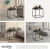Collage of a black metal side table with a tray and decorative items, shown in different room settings. Produktbild-Vorschau