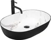 A black and white marble-patterned vessel sink with a black faucet. Náhľad obrázku produktu