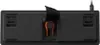 The underside of a black keyboard with an orange accent. Produktbild-Vorschau