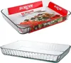 A collage of two images showing a glass baking dish. The top image shows the dish with its packaging, which includes promotional text and images of food. The bottom image shows the empty dish on a white background. Produktbild-Vorschau