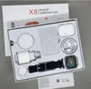 A product box containing a smartwatch, charging accessories, and earbuds. Voir les images du produit