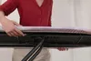 A person's hands adjusting an ironing board. Voir les images du produit