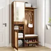A hallway furniture set with a mirror, storage, and seating, placed next to a door. Produktbild-Vorschau