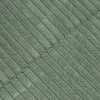 A close-up, textured view of a green fabric with ribbed lines. Podgląd zdjęcia produktu