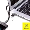A black USB to Lightning cable is shown connecting a smartphone to a laptop. A ruler is placed next to the cable, indicating its length. Anteprima dell’immagine prodotto