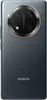 The back of a black Honor Magic7 Lite 5G smartphone with a circular camera module. Produktbild-Vorschau