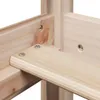 Close-up view of the wooden frame of a bed, showing the joinery and screws. Voir les images du produit