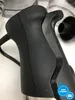 A close-up view of the handle of a black kitchen mixer. Produktbild-Vorschau