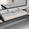 A modern bathroom sink with two faucets. Náhľad obrázku produktu