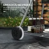 A close-up view of a grill's wheel and shelf with bottles and jars on it, with text overlay. Produktbild-Vorschau