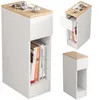 A narrow white nightstand with a wooden top, shown from multiple angles. One angle shows books on a shelf and a drawer slightly open. Another angle shows just the nightstand. Produktbild-Vorschau