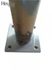 A close-up of the base of a stainless steel table leg, showing the mounting plate with screw holes. Produktbild-Vorschau
