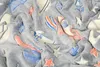 A close-up view of a soft, plush blanket with a space-themed pattern. Náhled obrázku produktu