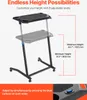 A black adjustable height desk on wheels, shown in two positions to illustrate height adjustment. Podgląd zdjęcia produktu