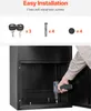 A person is using a drill to install a black metal mailbox. Voir les images du produit