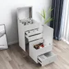A white makeup vanity with a mirror and drawers, placed on a wooden floor next to a window with blue curtains. Produktbild-Vorschau