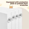 A close-up view of the bottom section of a white pet gate, showing the protective pads on the bottom. Text overlays describe the product's features. Podgląd zdjęcia produktu