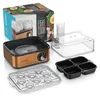 A cooking appliance with its accessories and packaging, arranged on a white background. Náhľad obrázku produktu