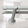 A close-up view of a double curtain rod mounted in a bedroom setting. Podgląd zdjęcia produktu