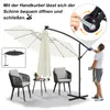 A man is shown operating a cantilever umbrella with LED lights, next to two chairs and a small table, suggesting an outdoor living space. Produktbild-Vorschau