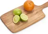 A wooden cutting board with an orange and two limes on it. Podgląd zdjęcia produktu