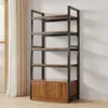 A tall, multi-shelf industrial-style bookshelf with a wooden cabinet base, shown against a plain wall with curtains to the left. Produktbild-Vorschau