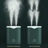Two humidifiers are shown side-by-side, demonstrating continuous spraying and interval spraying modes. Náhled obrázku produktu
