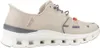 A side view of a beige Skechers slip-in sneaker against a white background. Voir les images du produit