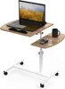 A mobile laptop table with two tiers, a laptop, a mouse, and a mug on a white background. Produktbild-Vorschau