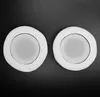 Two white ear pads for headphones are shown against a black background. Náhled obrázku produktu
