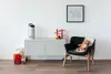 A child's room with a white cabinet, a toy rack, a stuffed fox on a chair, and a stuffed sheep in a basket. Anteprima dell’immagine prodotto