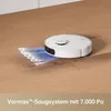 A white robot vacuum cleaner is cleaning a wooden floor, with a graphic showing "7,000Pa" projected onto the floor. Produktbild-Vorschau