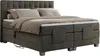 A dark gray boxspring bed with a tufted headboard, two mattresses, and bedding. Produktbild-Vorschau